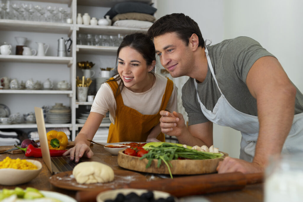 Happy married couple cooking dinner together and enjoying shared joy.