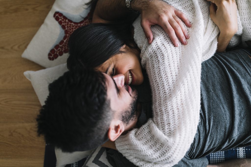 Spouses embracing after reconciliation, symbolizing a shared win in marriage.